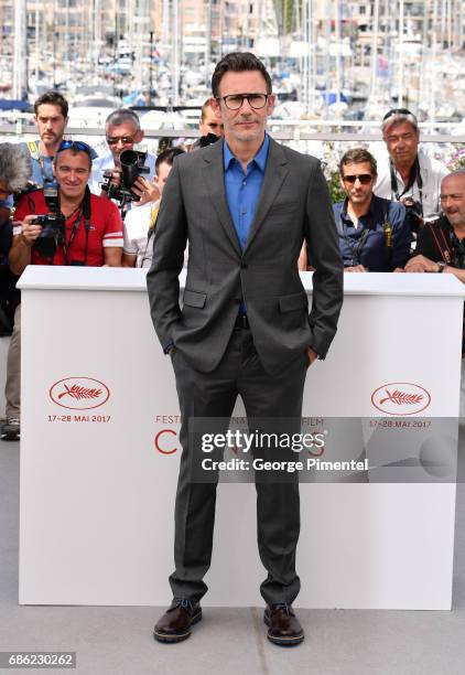 Director Michel Hazanavicius attends the "Redoubtable " photocall during the 70th annual Cannes Film Festival at Palais des Festivals on May 21, 2017...