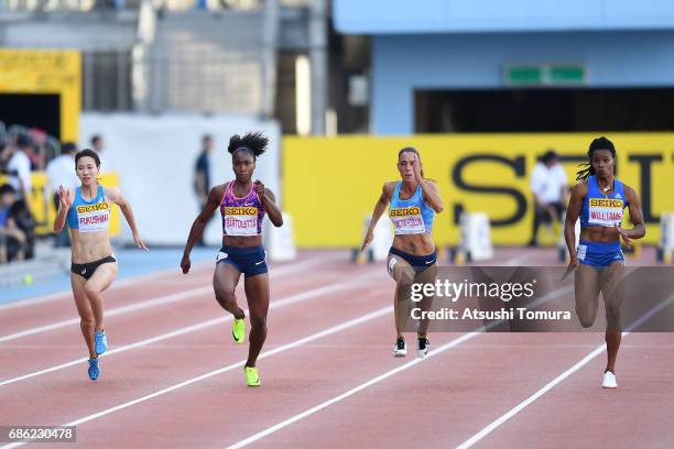 Chisato Fukushima of Japan, Tianna Bartoletta of the USA, Ivet Lalova-Collio of Bulgaria and Charonda Williams of the USA compete in the Women's 100m...