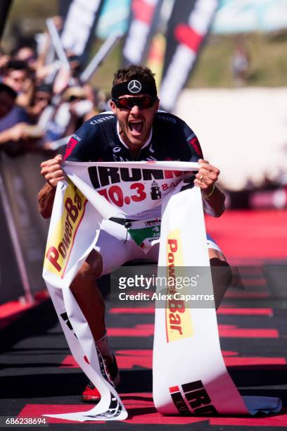Jan Frodeno of Germany celebrates as he wins Ironman 70.3 Barcelona race on May 21, 2017 in Barcelona, Spain.