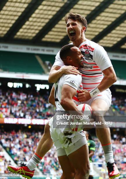 Alex Davis celebrates with Dan Norton of England after he touches down a try during the match between England and South Africa during day two of the...