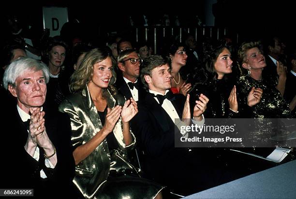 Andy Warhol, Lauren Hutton, Mikhail Baryshnikov, Brooke Shields and Pat Kennedy Lawford attend the Valentino fashion show circa 1982 in New York City.