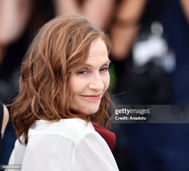 French actress Isabelle Huppert poses during a photocall for the film Claires camera photocall out of competition at the 70th annual Cannes Film...