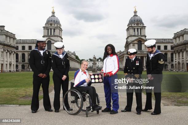 Hannah Cockcroft and Asha Phillip pose for pictures with Naval Officers and the medals for the World Para Athletics Championships and IAAF World...