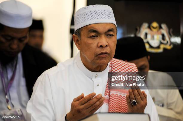 Malaysian Deputy Prime Minister and Home Minister Ahmad Zahid Hamidi offers prayers inside the Federal Territory Mosque during the gathering for...