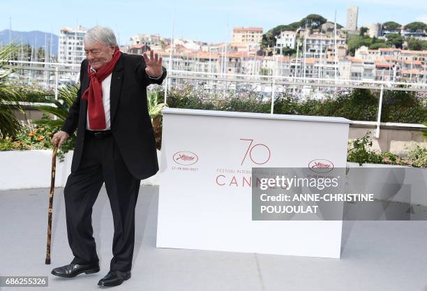 French director Claude Lanzmann waves on May 21, 2017 during a photocall for the film 'Napalm' at the 70th edition of the Cannes Film Festival in...