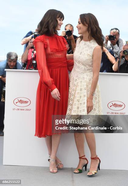 Actresses Stacy Martin and Berenice Bejo attend the "Redoutable " photocall during the 70th annual Cannes Film Festival at Palais des Festivals on...