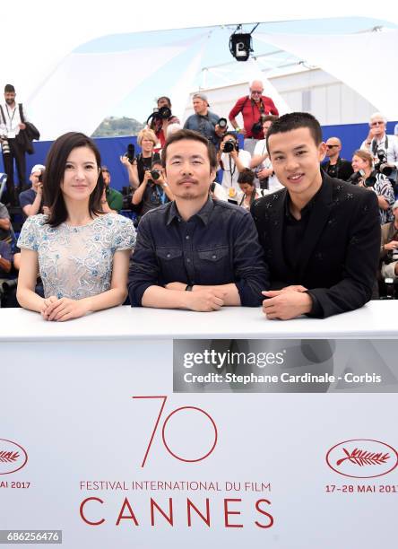 Actor Yang Zishan, director Li Ruijun and actor Yin Fang attend the "Walking Past The Future " photocall during the 70th annual Cannes Film Festival...