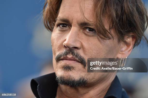 Actor Johnny Depp arrives at the premiere of Disney's 'Pirates of the Caribbean: Dead Men Tell No Tales' at Dolby Theatre on May 18, 2017 in...