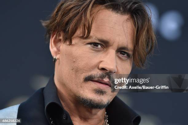 Actor Johnny Depp arrives at the premiere of Disney's 'Pirates of the Caribbean: Dead Men Tell No Tales' at Dolby Theatre on May 18, 2017 in...