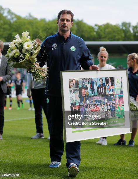 Head coach Ralf Kellermann of VfL Wolfsburg looks on during his farewell ceremony ahead of the Allianz Women's Bundesliga match between VfL Wolfsburg...