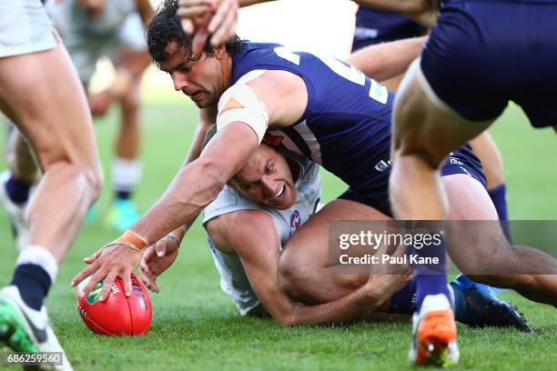 Brady Grey of the Dockers and Sam Docherty of the Blues contest for the ball during the round nine AFL match between the Fremantle Dockers and the...