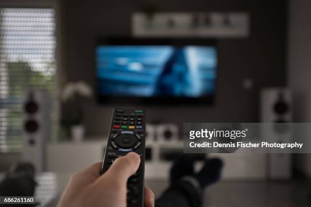 television remote control - high definition television television set stock pictures, royalty-free photos & images