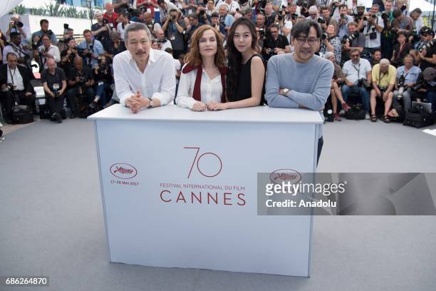 South Korean director Sangsoo Hong , French actress Isabelle Huppert , South Korean actress Minhee Kim pose during a photocall for the film Claires...