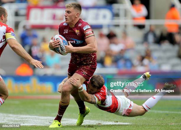 Huddersfield Giants' Alex Mellor is tackled by Catalans Dragons Richie Myler during day two of the Betfred Super League Magic Weekend at St James'...