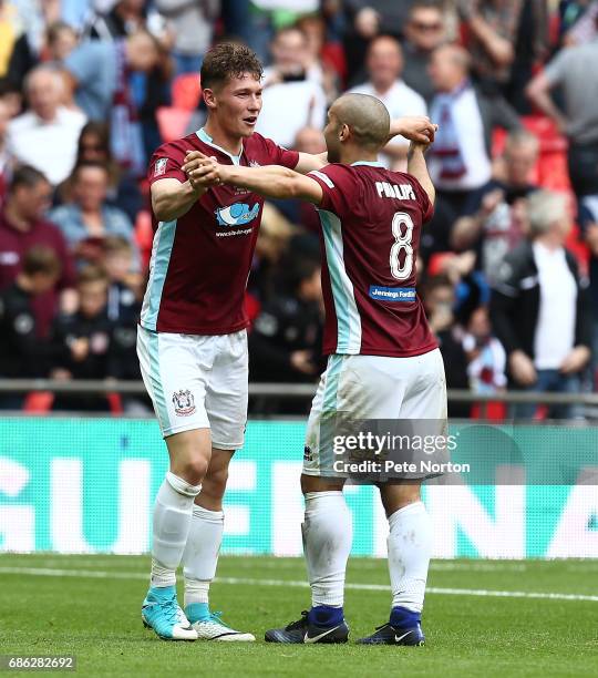 Dillon Morse of South Shields is congatulated by team mate Wayne Phillips after scoring his sides srcond goal during The Buildbase FA Vase Final...