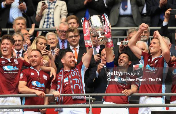 Julio Arca of South Shields lifts the FA Vase with his team mates after The Buildbase FA Vase Final between South Shields and Cleethorpes Town at...