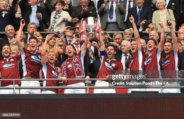 Julio Arca of South Shields lifts the FA Vase with his team mates after The Buildbase FA Vase Final between South Shields and Cleethorpes Town at...