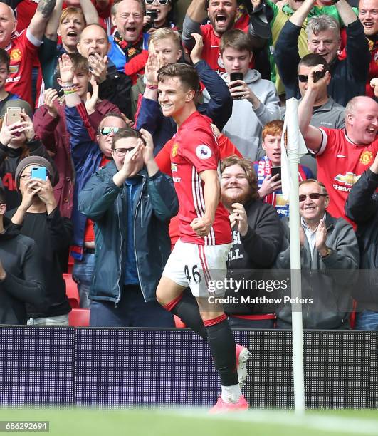 Josh Harrop of Manchester United celebrates scoring their first goal during the Premier League match between Manchester United and Crystal Palace at...