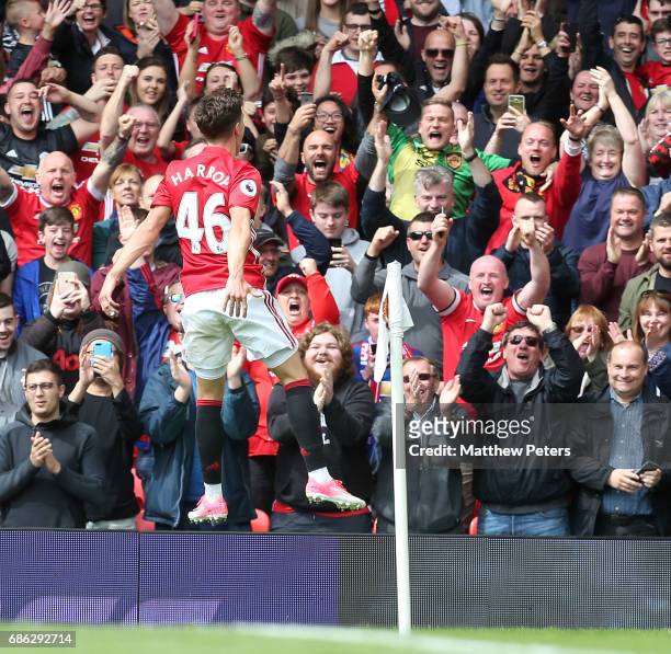 Josh Harrop of Manchester United celebrates scoring their first goal during the Premier League match between Manchester United and Crystal Palace at...