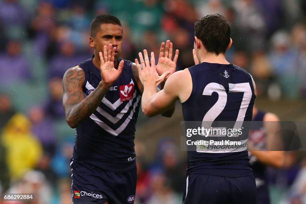 Bradley Hill and Lachie Neale of the Dockers celebrate a goal during the round nine AFL match between the Fremantle Dockers and the Carlton Blues at...
