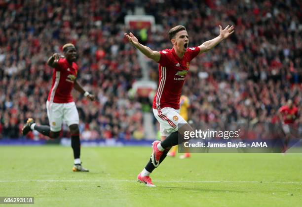Josh Harrop of Manchester United celebrates after scoring a goal to make it 1-0 during the Premier League match between Manchester United and Crystal...