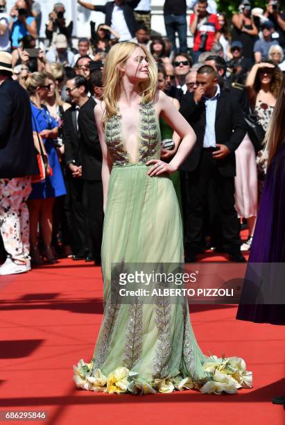 Actress Elle Fanning arrives on May 21, 2017 for the screening of the film 'How to talk to Girls at Parties' at the 70th edition of the Cannes Film...