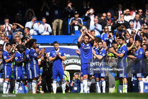 Chelsea players form a guard of honour as John Terry of Chelsea leaves the pitch for the final time following an injury during the Premier League...