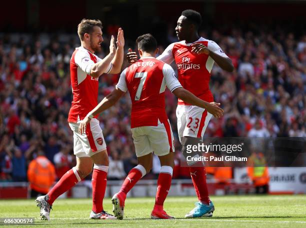 Alexis Sanchez of Arsenal celebrates scoring his sides second goal with Aaron Ramsey of Arsenal and Danny Welbeck of Arsenal during the Premier...
