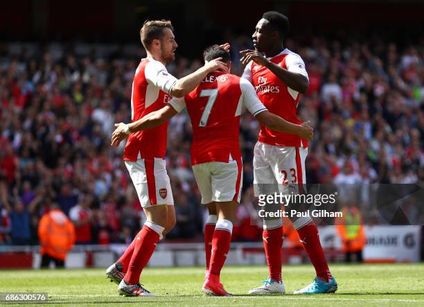 Alexis Sanchez of Arsenal celebrates scoring his sides second goal with Aaron Ramsey of Arsenal and Danny Welbeck of Arsenal during the Premier...