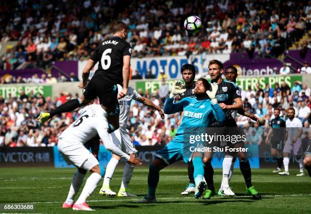 Jonny Evans of West Bromwich Albion scores his sides first goal during the Premier League match between Swansea City and West Bromwich Albion at...