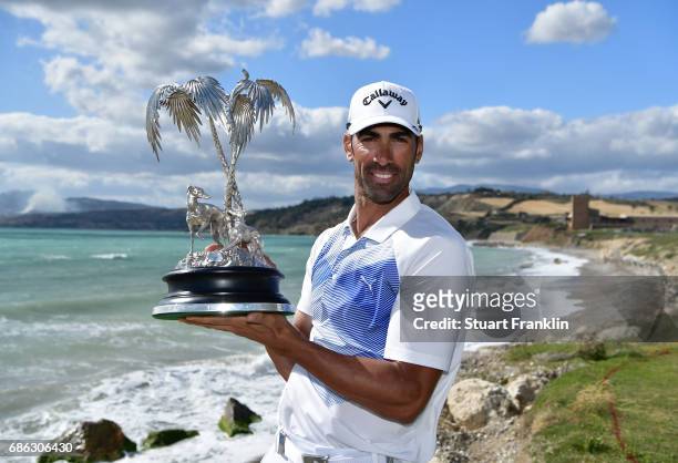 Alvaro Quiros of Spain holds the trophy after winning The Rocco Forte Open at The Verdura Golf and Spa Resort on May 21, 2017 in Sciacca, Italy.