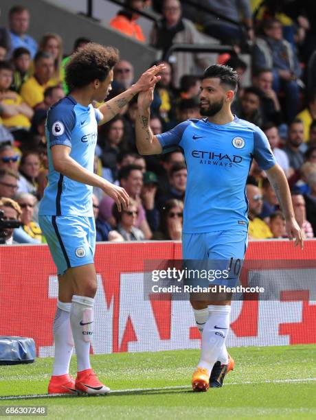 Sergio Aguero of Manchester City celebrates scoring his sides third goal with Leroy Sane of Manchester City during the Premier League match between...