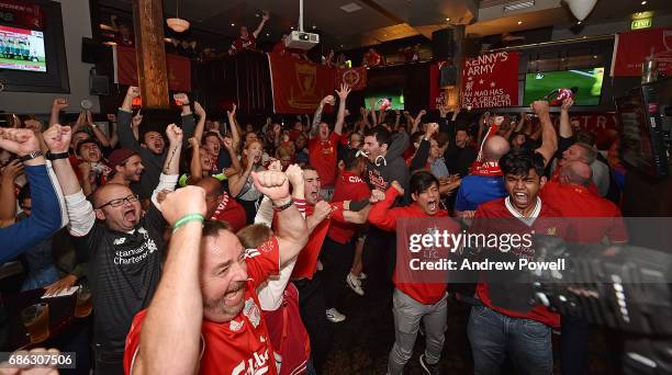 Fans of Liverpool celebrating the opening goal scored by Georginio Wijnaldum during a viewing party of the Premier League match between Liveprool and...