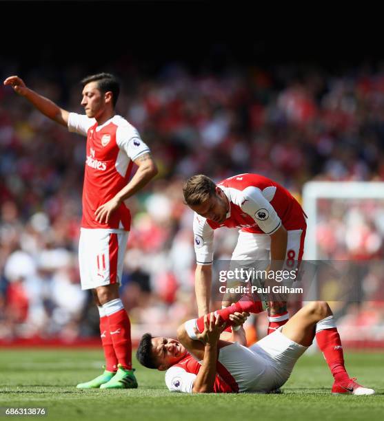Aaron Ramsey of Arsenal checks if Alexis Sanchez of Arsenal is ok during the Premier League match between Arsenal and Everton at Emirates Stadium on...