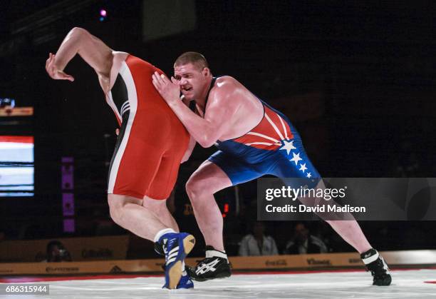 Rulon Gardner of the United States wrestles Georgi Tsurtsumia of Kazakhstan during the freestyle wrestling event of the Titan Games on February 15,...