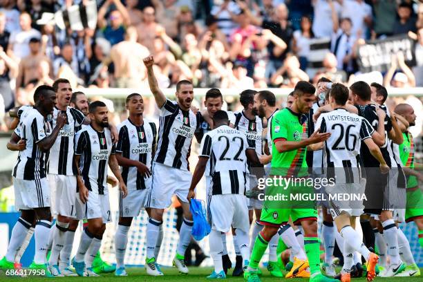 Juventus' players celebrate after winning the Italian Serie A football match Juventus vs Crotone and the "Scudetto" at the Juventus Stadium in Turin...
