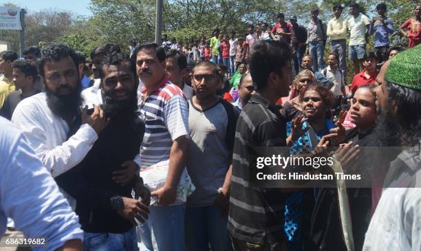 Fire personnel, Police personnel and bystander helping in rescuing passenger after a Private bus transporting people for reception from Malad to...