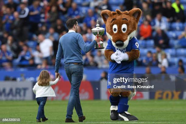 World Snooker Champion Mark Selby perades his trophy at half time during the Premier League match between Leicester City and AFC Bournemouth at The...