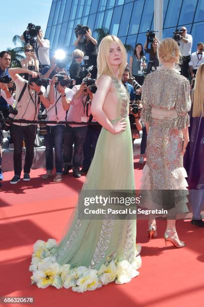 Actresses Elle Fanning and Nicole Kidman attend the "How To Talk To Girls At Parties" screening during the 70th annual Cannes Film Festival at on May...