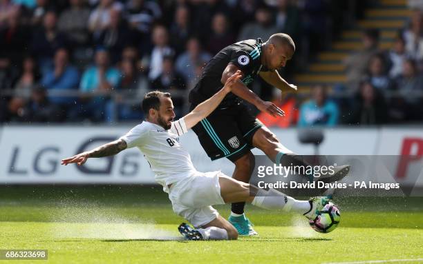 West Bromwich Albion's Salomon Rondon is tackled by Swansea City's Leon Britton during the Premier League match at the Liberty Stadium, Swansea.