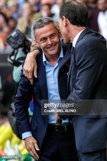 Valencia's head coach, Voro Gonzalez cheers Villarreal's head coach, Fran Escriba , before the Spanish League football match Valencia CF vs...