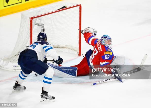 Finlands forward Mikko Rantanen scores a goal past Russias goalkeeper Andrei Vasilevski during the IIHF Men's World Championship Ice Hockey bronze...