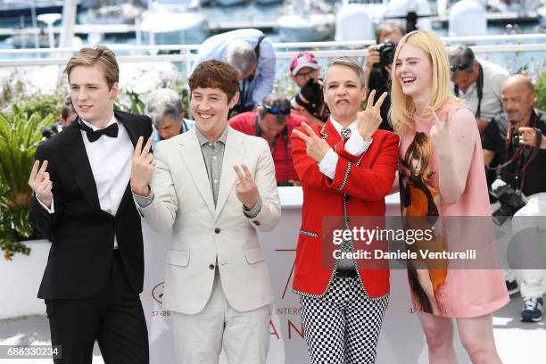 Aj Lewis, Alex Sharp, John Cameron Mitchell and Elle Fanning attend the "How To Talk To Girls At Parties" photocall during the 70th annual Cannes...