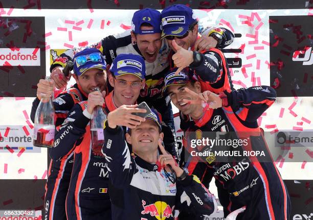 Winner French driver Sebastien Ogier takes a selfie photo with his French co-driver Julien Ingrassia and Belgian co-driver Nicolas Gilsoul, Belgian...