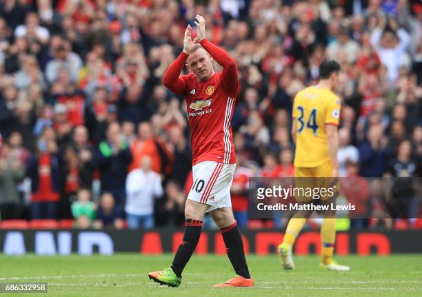 Wayne Rooney of Manchester United applauds supporters as he is subtituted during the Premier League match between Manchester United and Crystal...