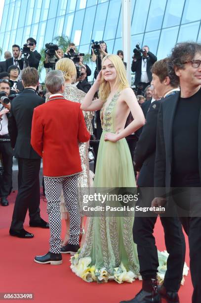 Elle Fanning departs after the "How To Talk To Girls At Parties" screening during the 70th annual Cannes Film Festival at Palais des Festivals on May...