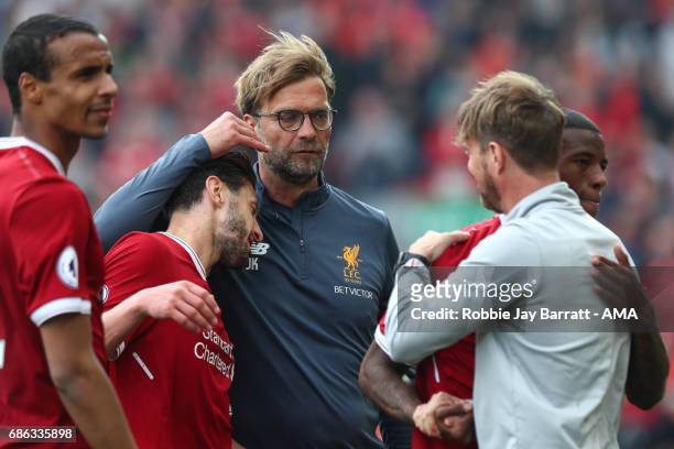 Jurgen Klopp manager / head coach of Liverpool and Adam Lallana of Liverpool celebrate at full time during the Premier League match between Liverpool...