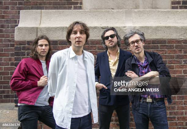 Members of French rock band Phoenix Deck d'Arcy, Thomas Mars, Christian Mazzalai and Laurent Brancowitz pose for a picture after an interview with...
