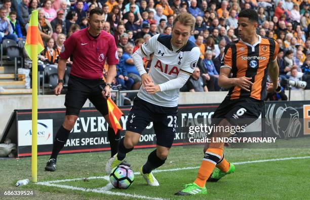 Tottenham Hotspur's Danish midfielder Christian Eriksen vies with Watford's English-born Jamaican defender Adrian Mariappa during the English Premier...