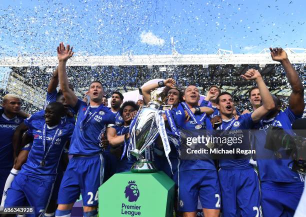 John Terry of Chelsea celebrates with the Premier League Trophy with his Chelsea team mates after the Premier League match between Chelsea and...